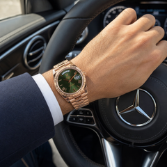Rolex Day-Date 40 Rose Gold Olive - Wrist shot, steering wheel