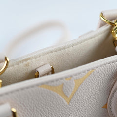 Louis Vuitton On The Go PM Empreinte Orange/Cream